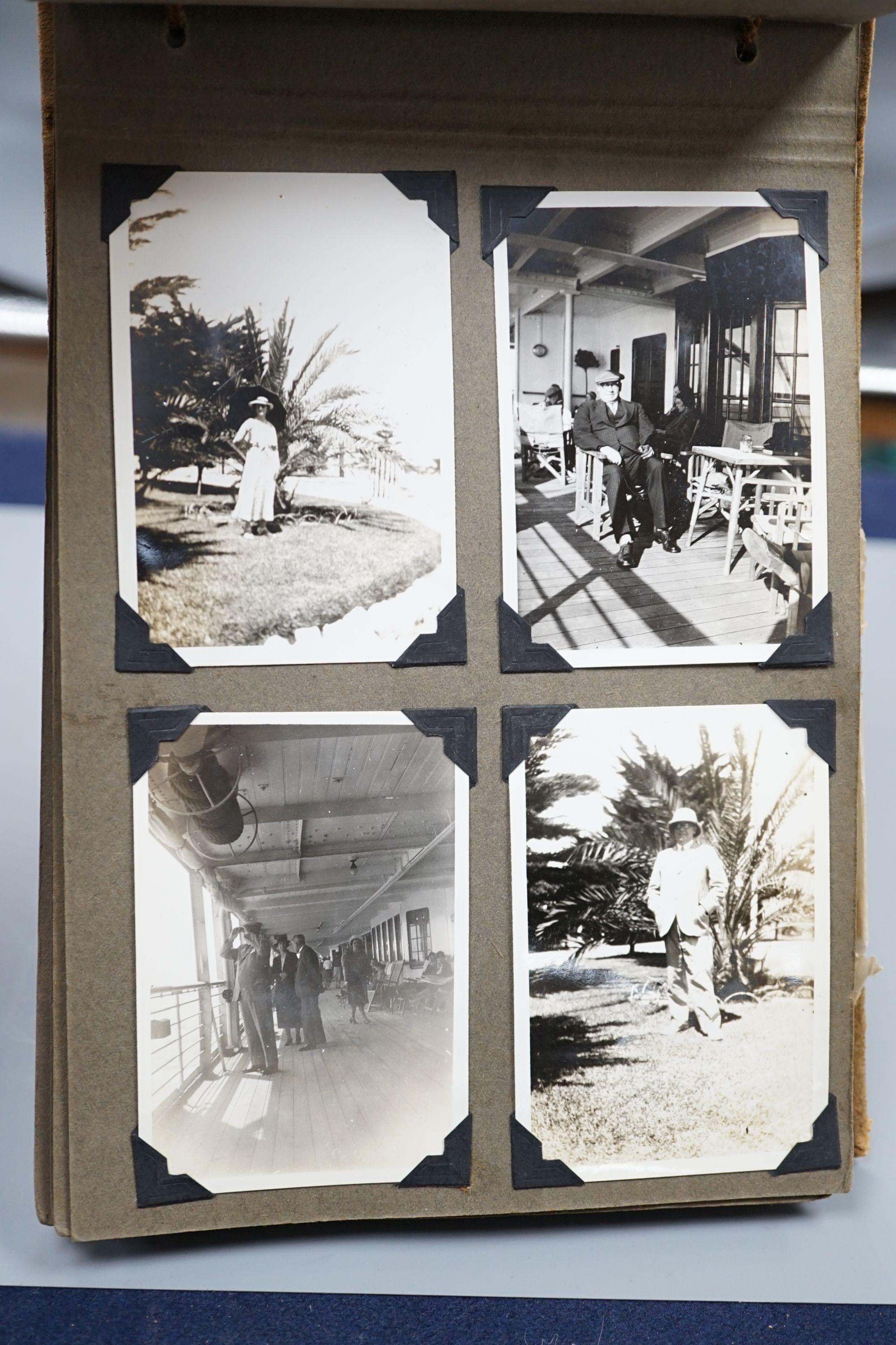A collection of postcards, a photo album and an album of silks